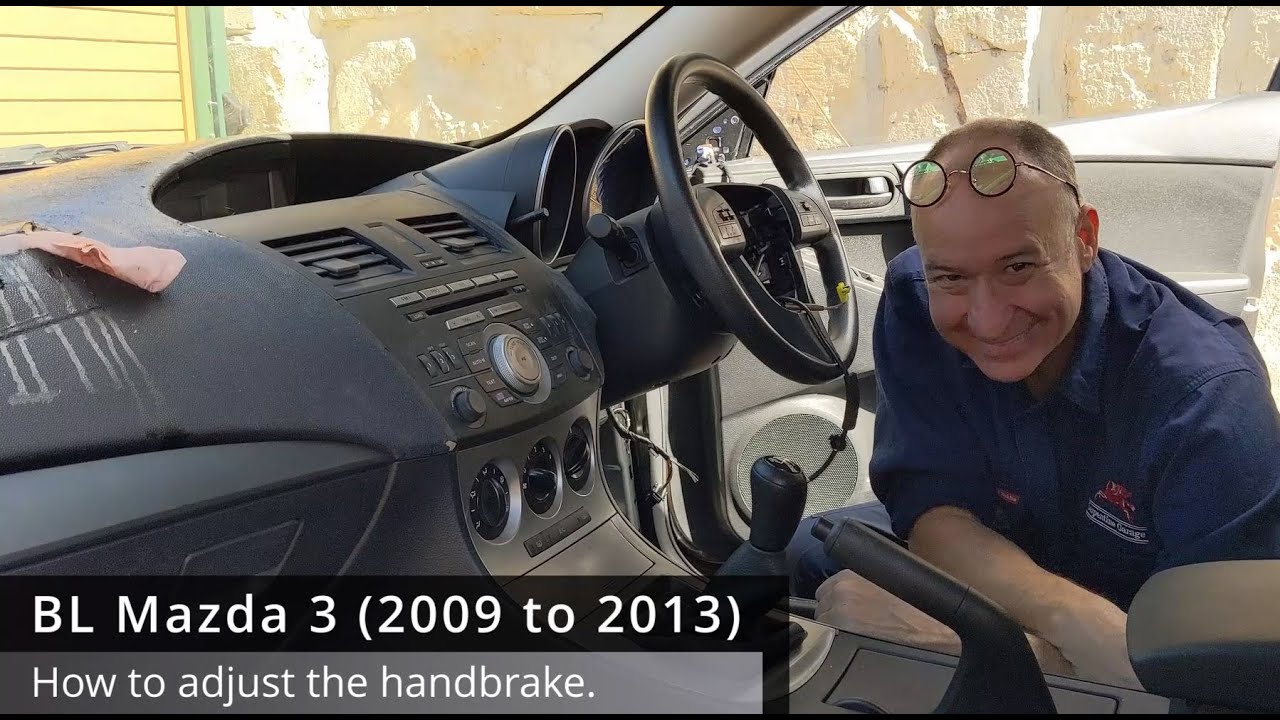 BL Mazda 3: Отрегулируйте ручной тормоз. 2009 2010 2011 2012 2013 2-го поколения, затяните ослабл...