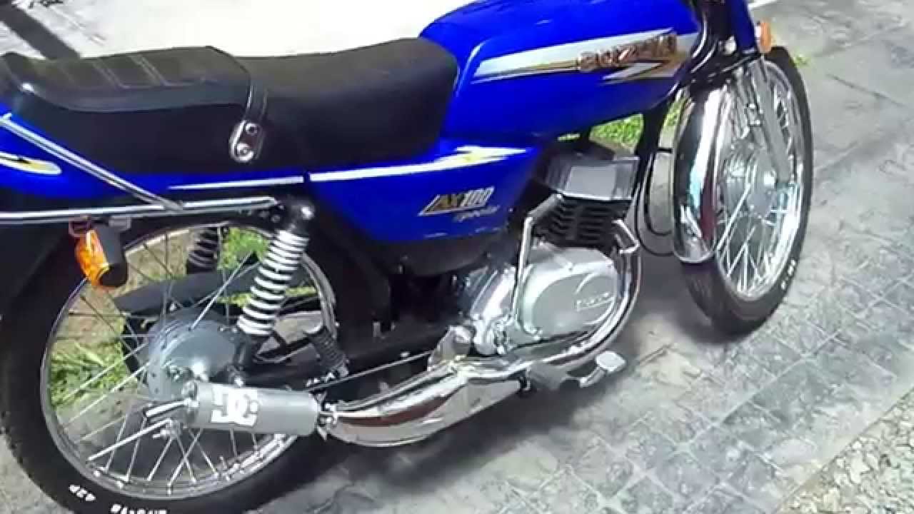 Suzuki Ax100 con escape DM