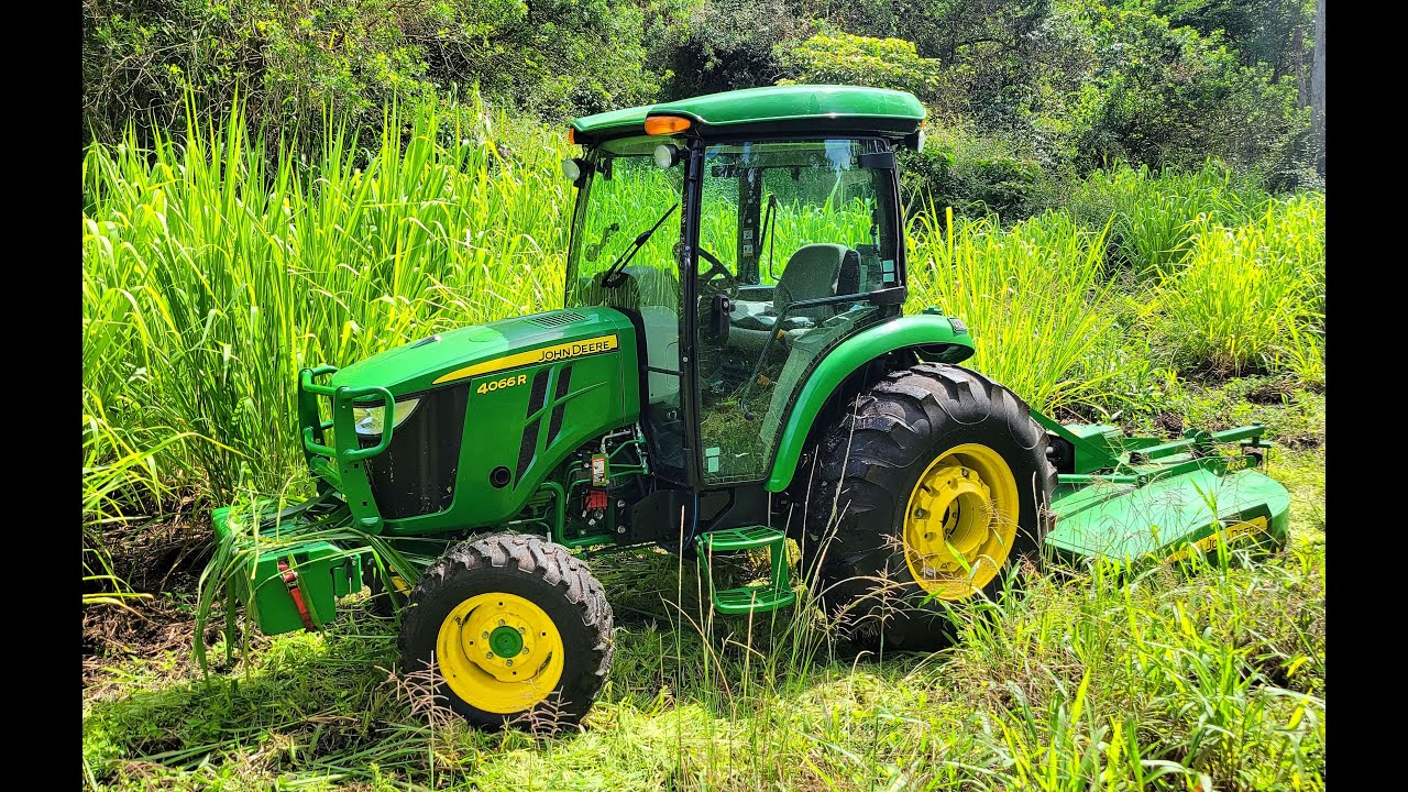 Massive Grass Growth taken care of with the John Deere 4066R