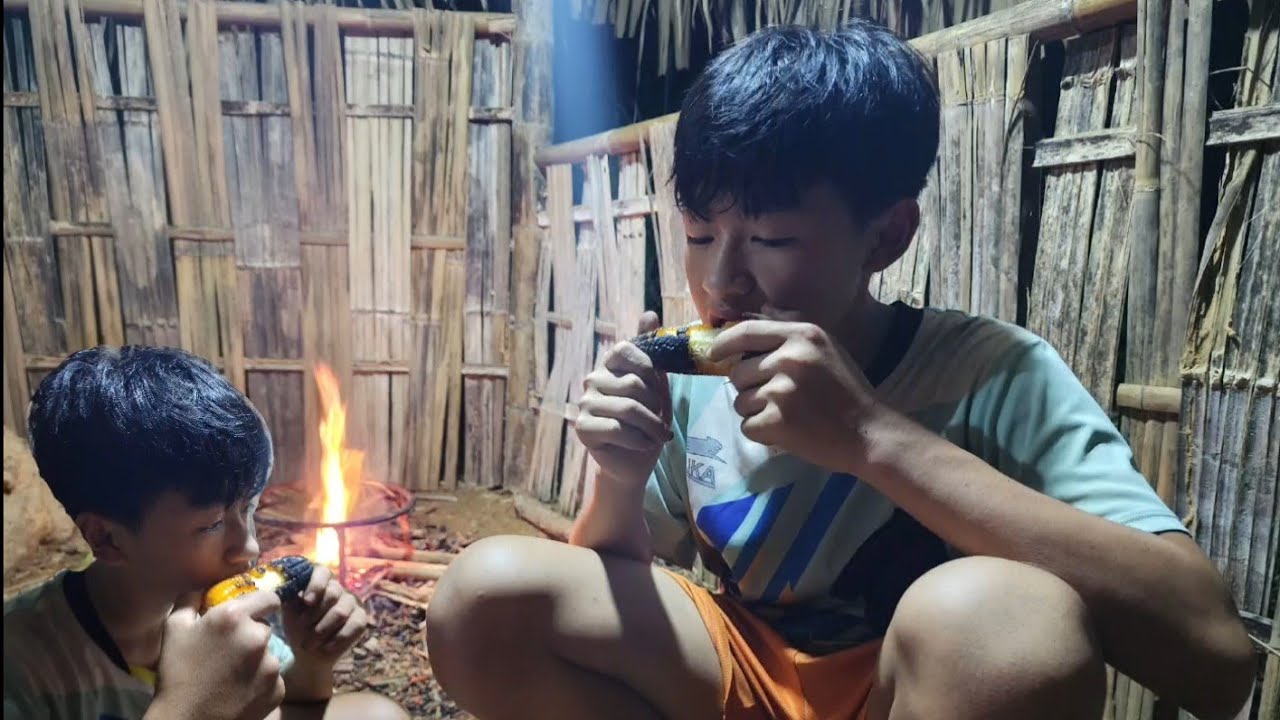 The little boy got some corn for his main meal