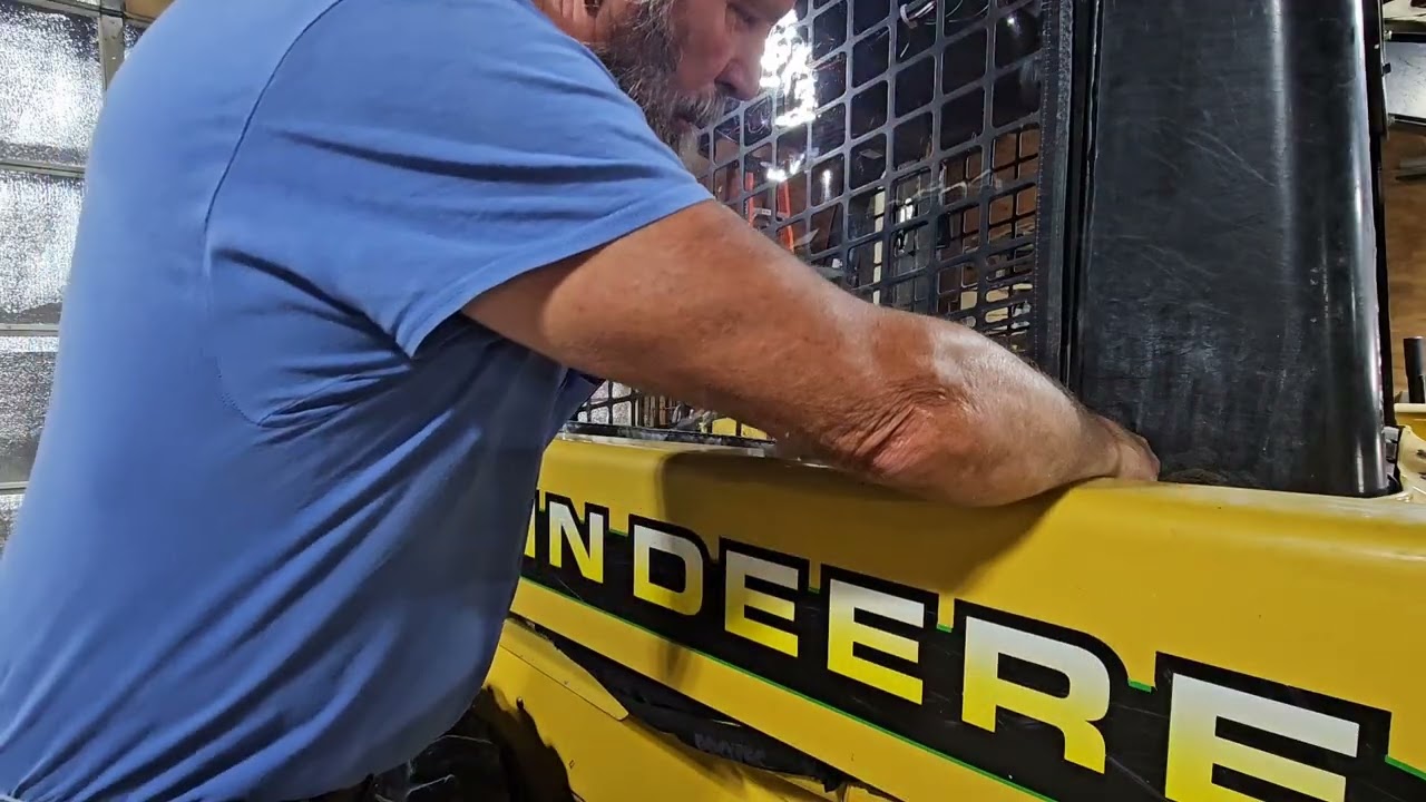 Installing a weather breaker on my John Deere  240 skid steer.