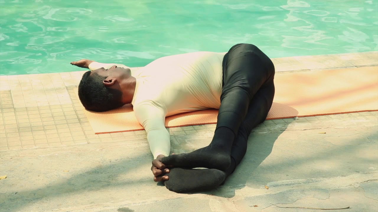 Jathara Parivartanasana (Abdominal Twist Pose)