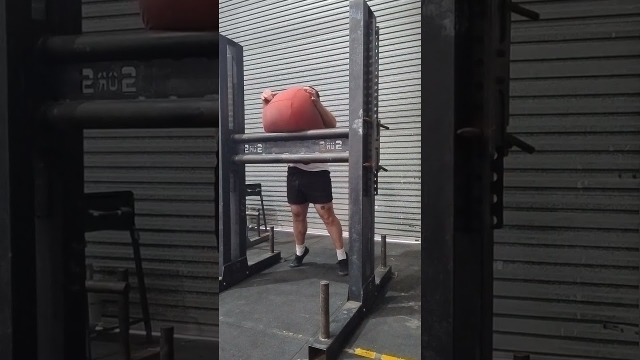 90kg (198lbs) sandbag over bar X8 under 60 seconds