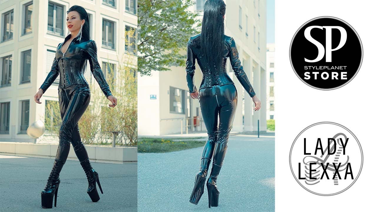 WALKING IN LACK CATSUIT, LACK CORSET AND EXTREM PLATEAU BOOTS FROM STYLEPLANET FASHION STORE.
