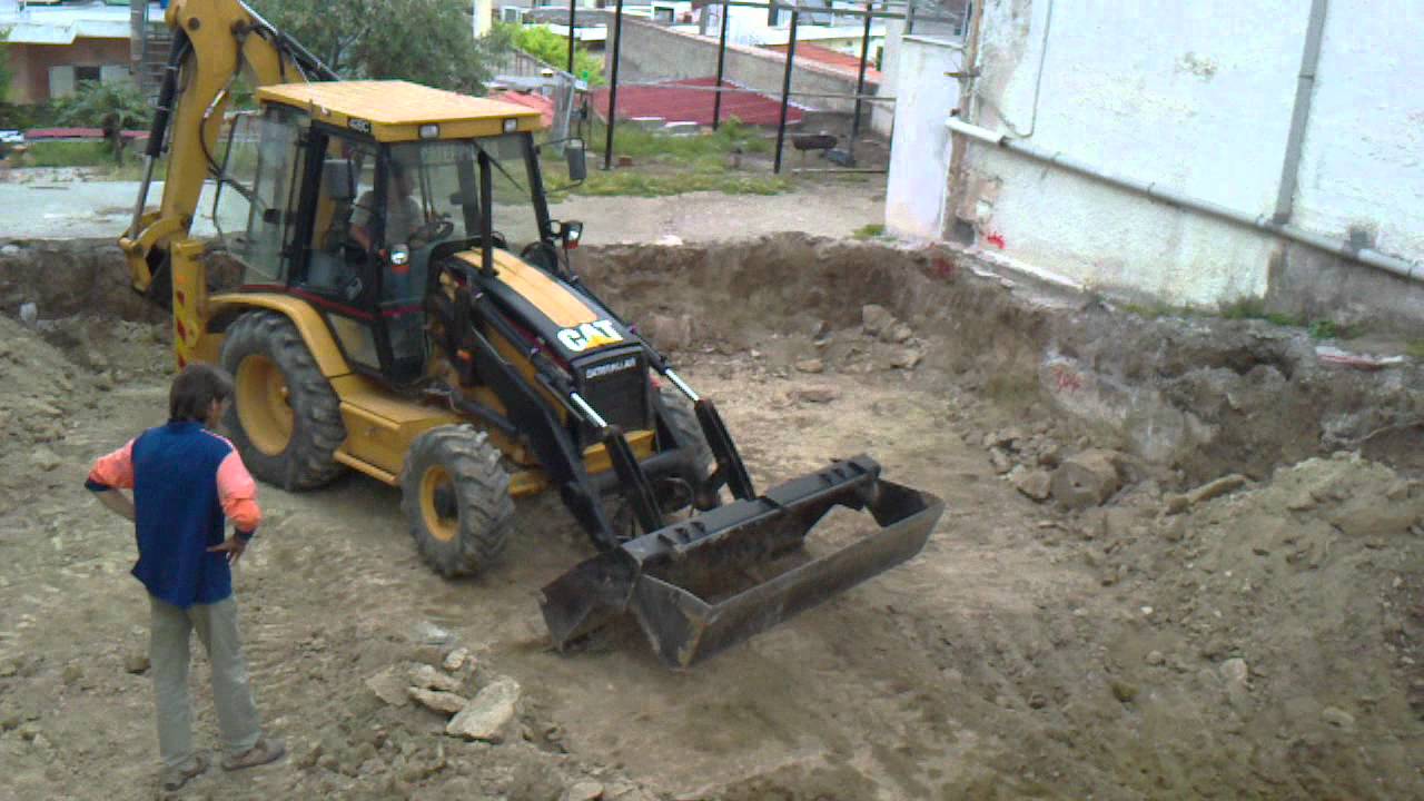 Caterpillar 428C in action
