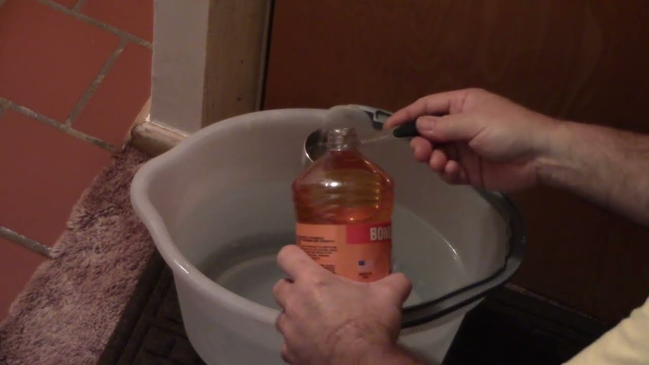 Cleaning The Floor With Pine Glo Orange