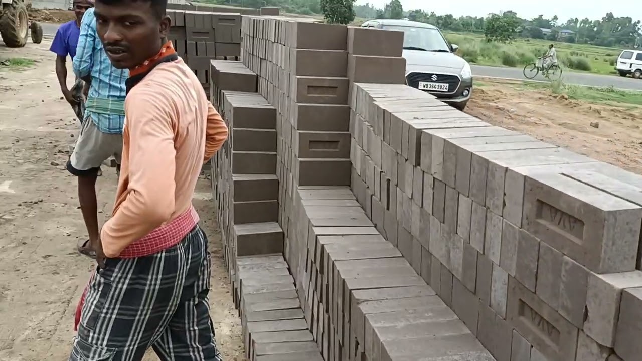 fly-ash bricks project (12bricks  one stock). bricks shifting for curing and ready material.