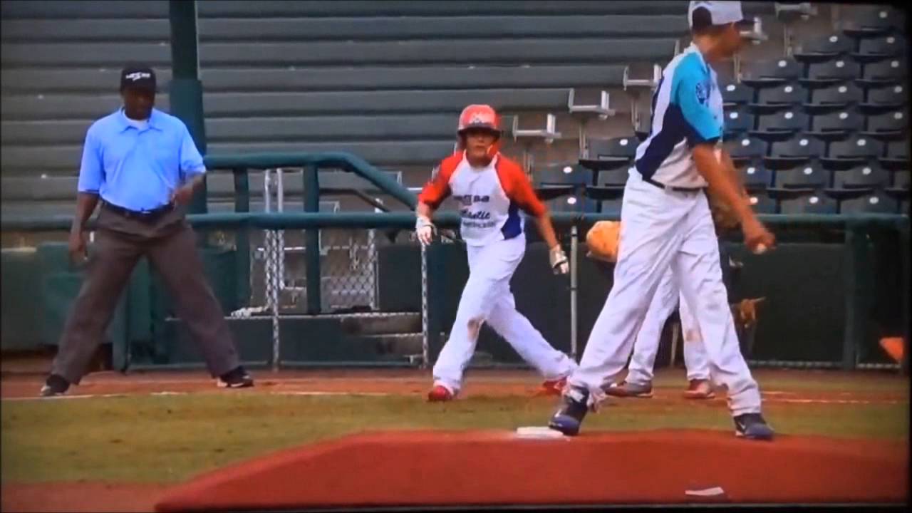 Smart 10-year-old pitcher picks off runner at 1st base.