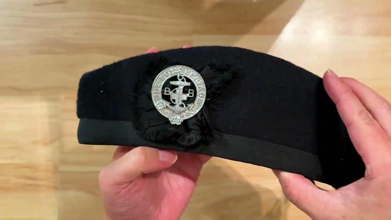 How to attach officer cap badge to officer cap?