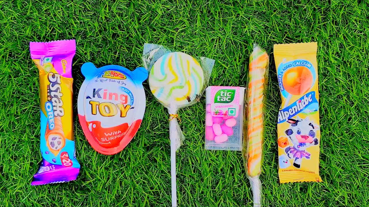 Most Popular Candys / some lots of colorful rainbow lollipop candy / unpacking chocolate eat