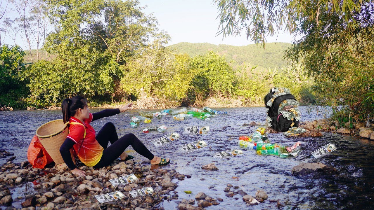 Poor girl picking up trash found a bag buried in a stream and the surprise inside - Daily Life