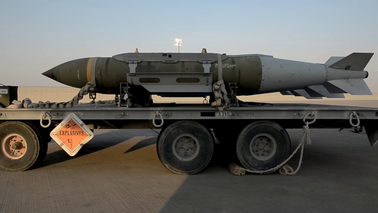 U.S. Airmen Prepare and Load Munitions onto B-52 Airplane