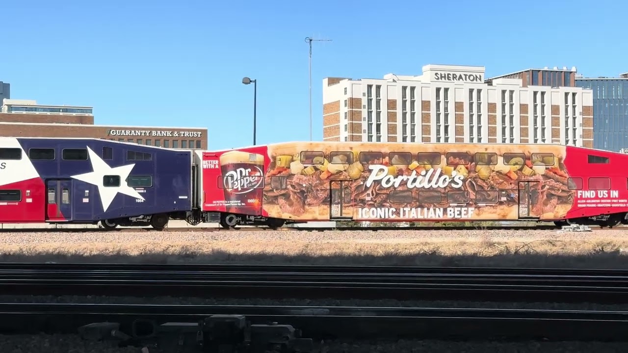 TRE with a special passenger car the Portillo’s hot dogs passing by the Tower 55 Diamond