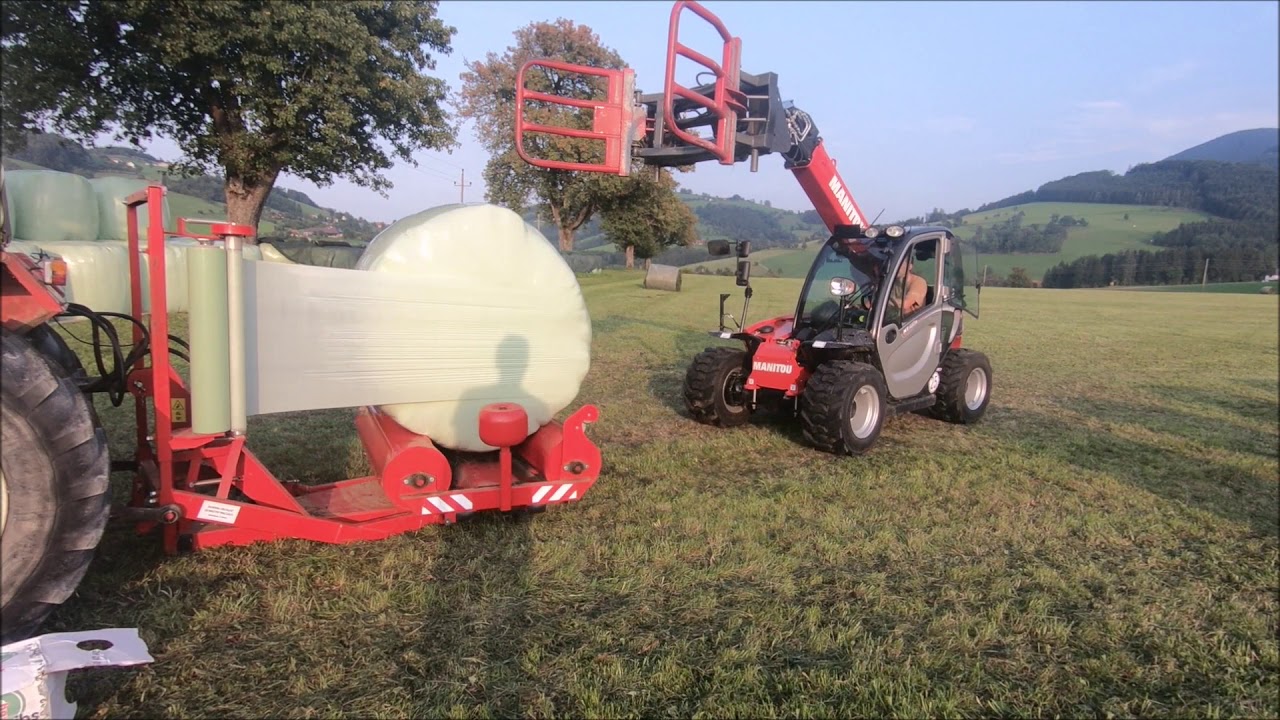 Manitou Teleskoplader und Steyr Traktor beim Rundballen wickeln | Metal Fach | Maschinen im Einsatz