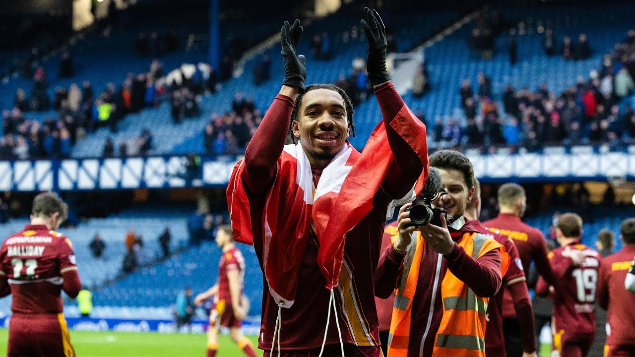 Theo Bair leads the Motherwell line in victory at Ibrox