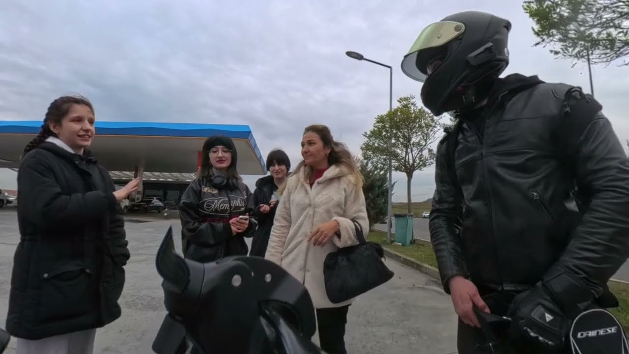 Four Girls Approaching a Biker at a Gas Station in Istanbul