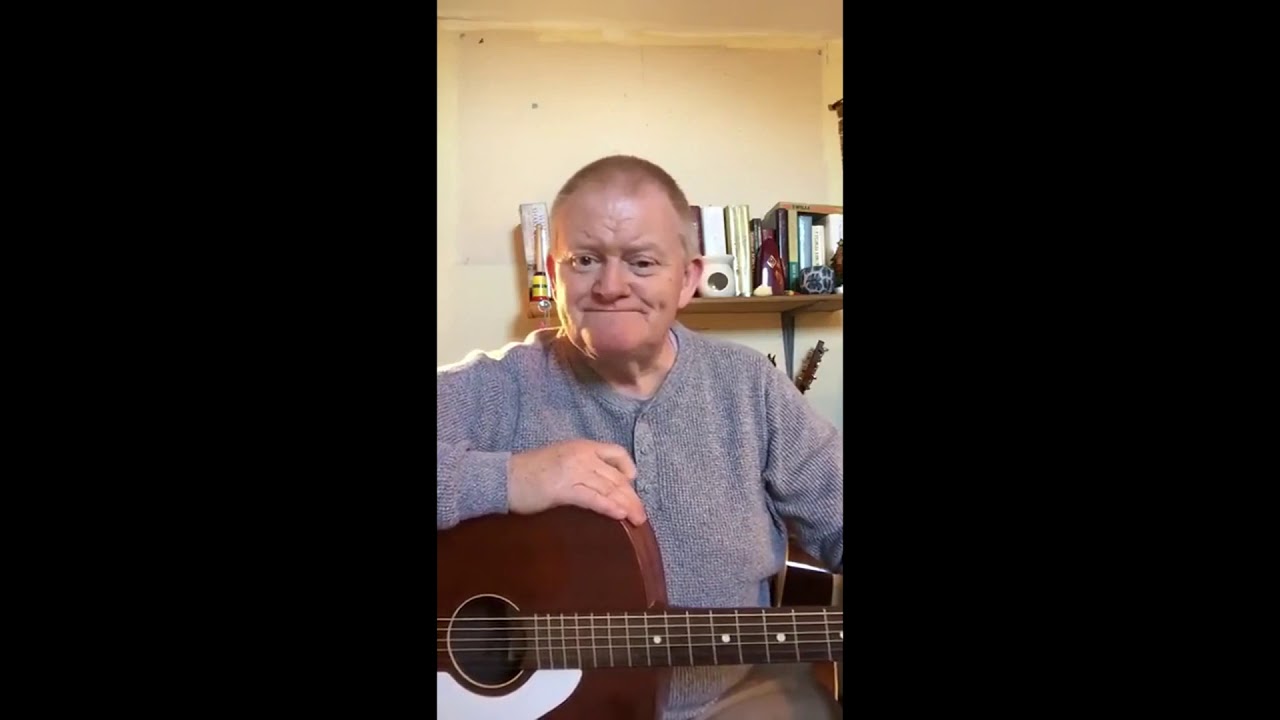 Old man playing guitar | Teeth fell off.