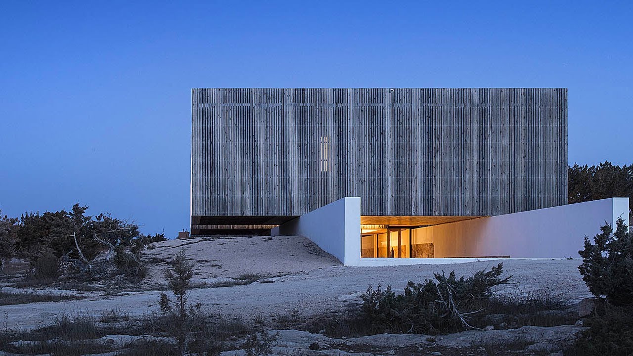A Modern Mediterranean House Nested In Stone