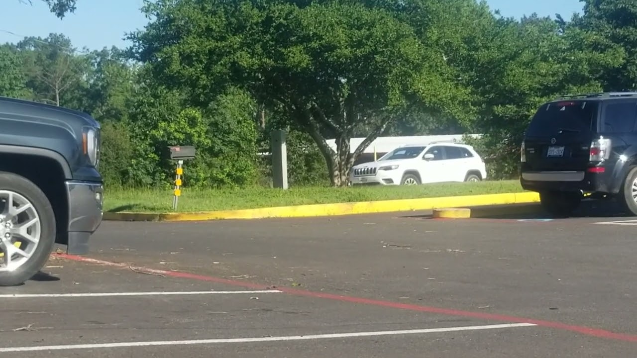Teenager Parallel parking taking drivers test.