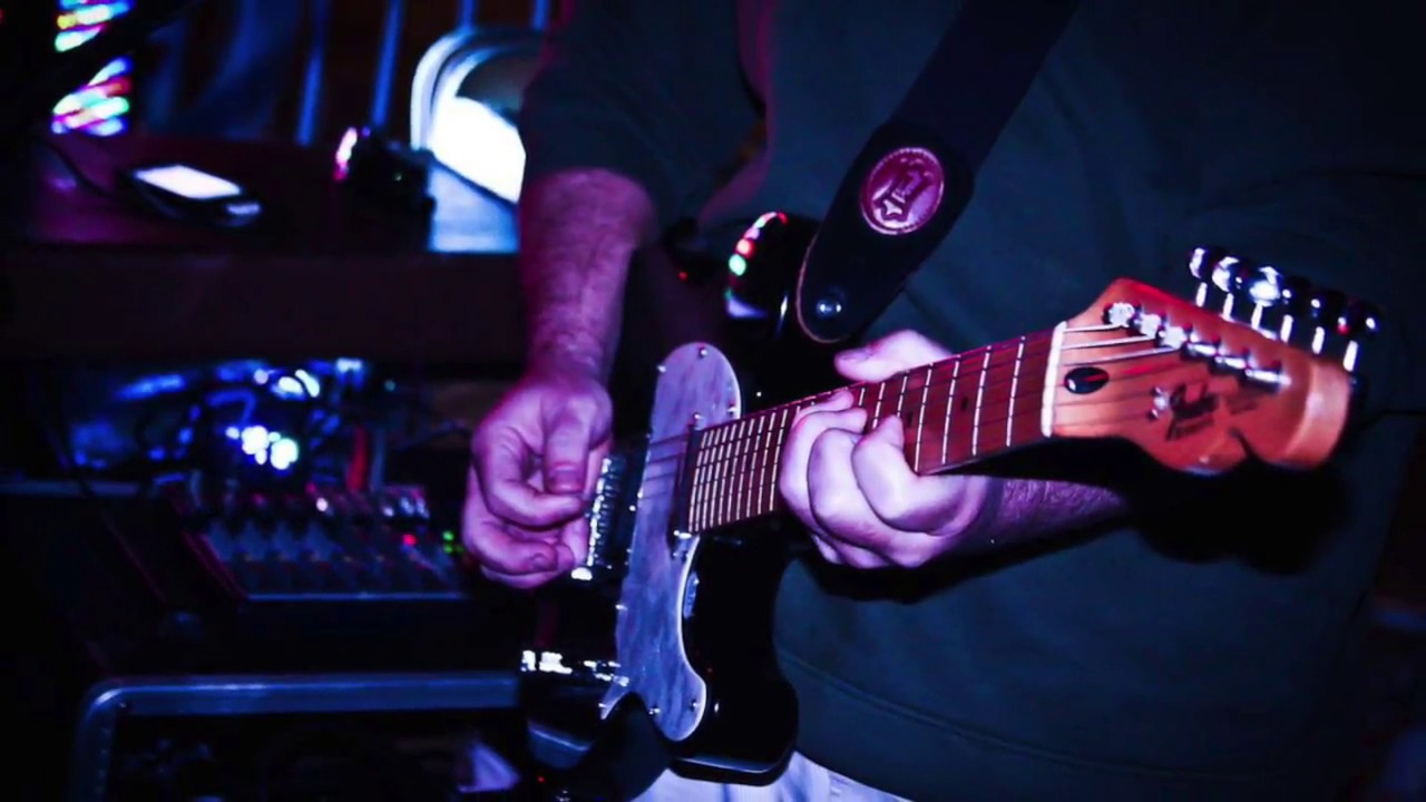 Tony Bowers Playing guitar and Singing