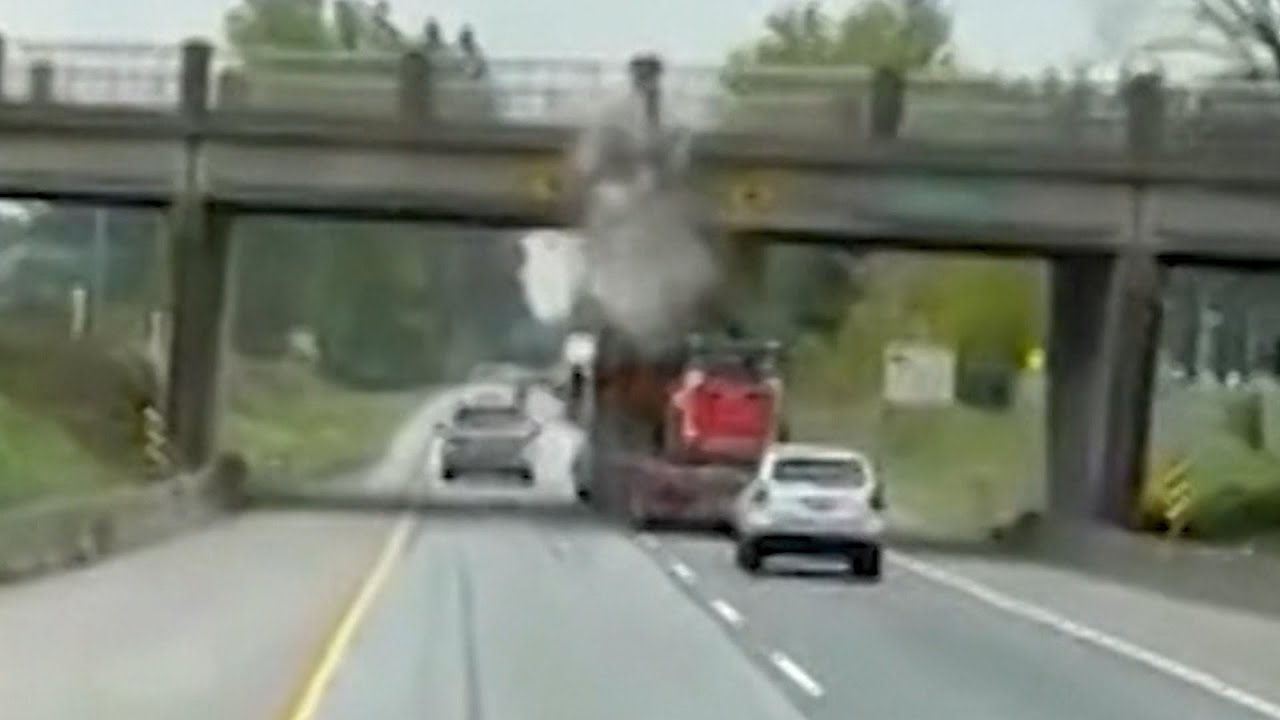 Loaded truck slams into highway overpass in British Columbia