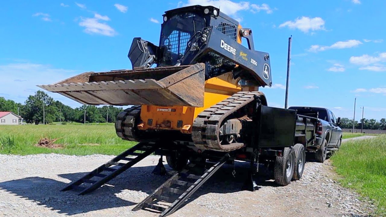 How to Safely Load and Haul a Skid Steer in a Dump Trailer