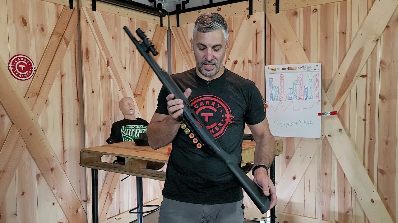 Loading a shotgun from shell carrier
