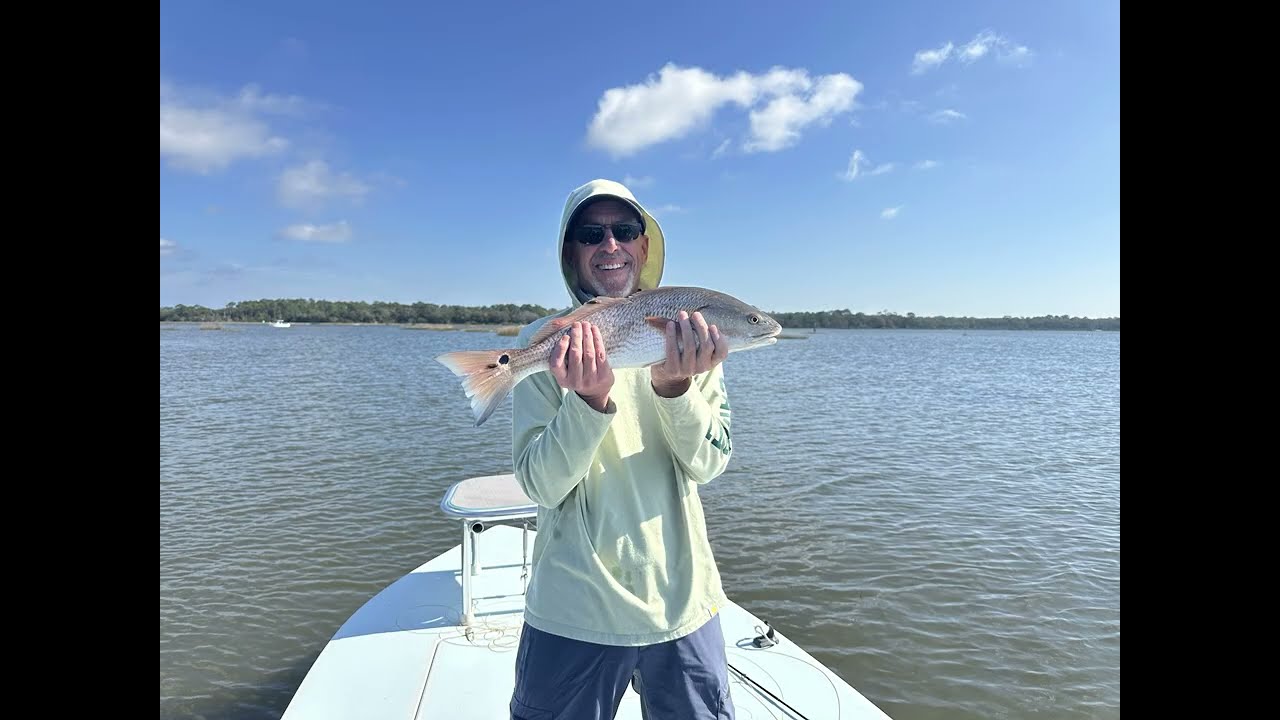 Doug Albig catching a red drum on a fly rod