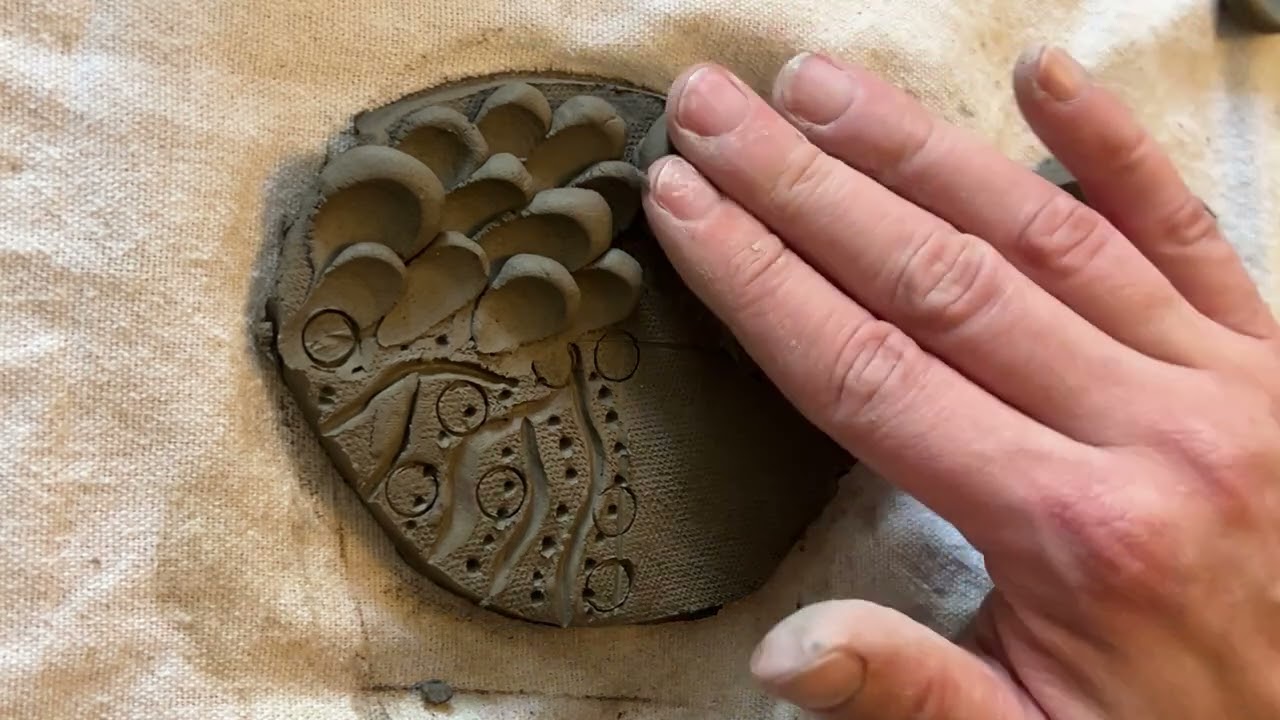 Applied and incised textures in clay