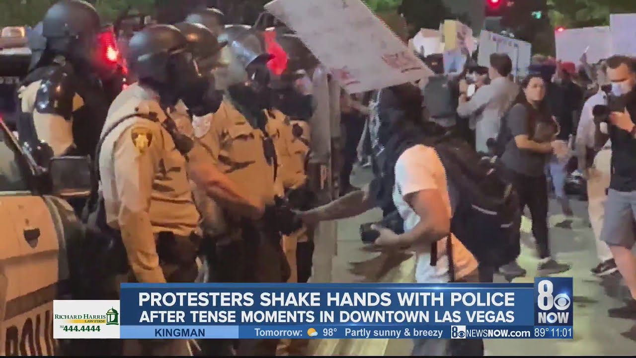 Protesters shake hands with police, after tense moments in Downtown Las Vegas