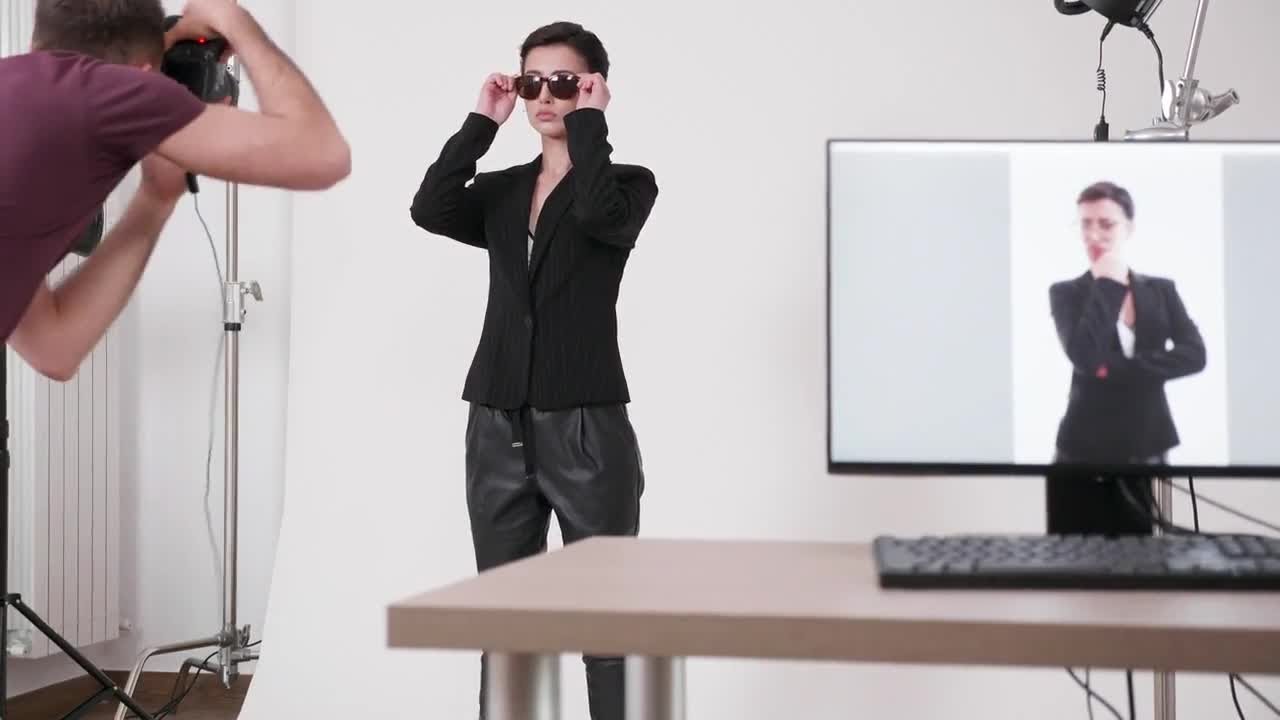 Model With Sunglasses Posing For Photographer Stock Video