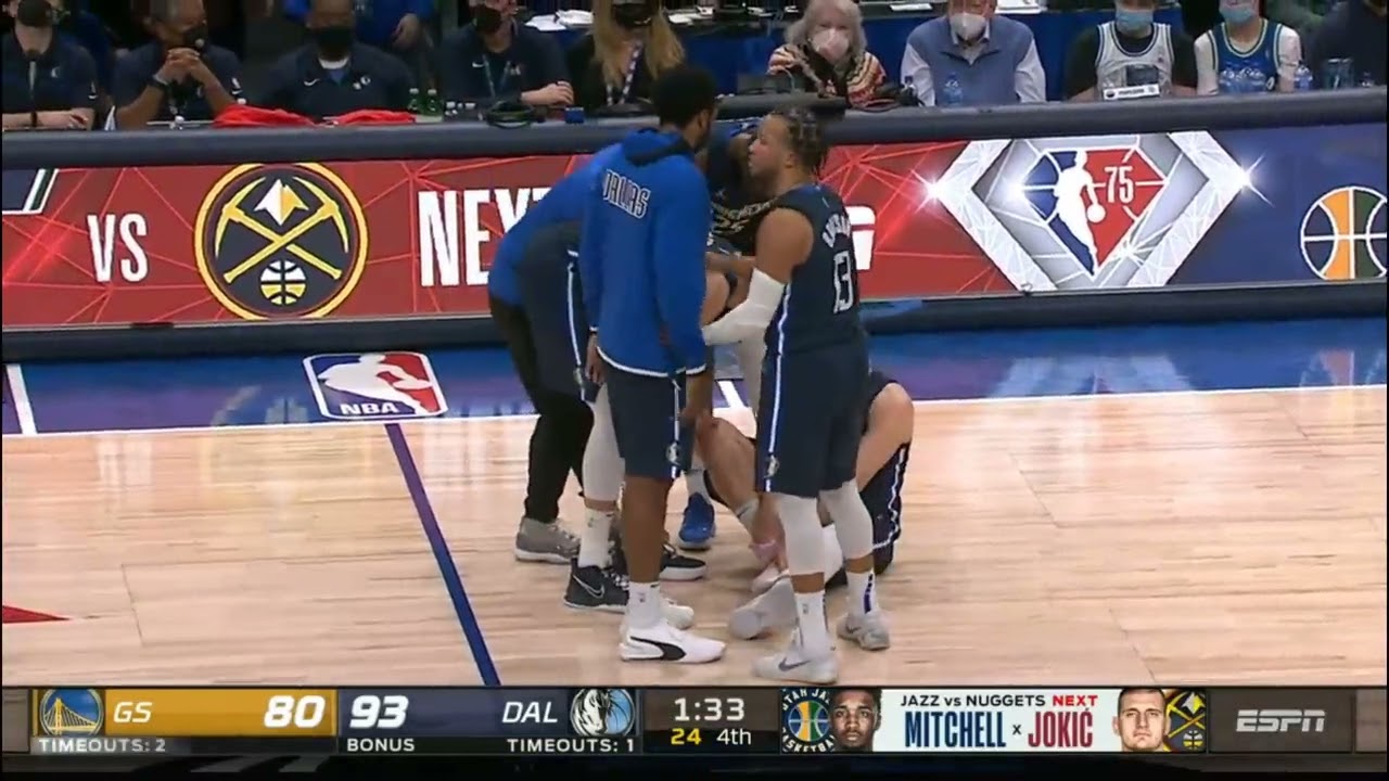 Luka Doncic collapses & slams the floor in pain after ankle injury vs Warriors