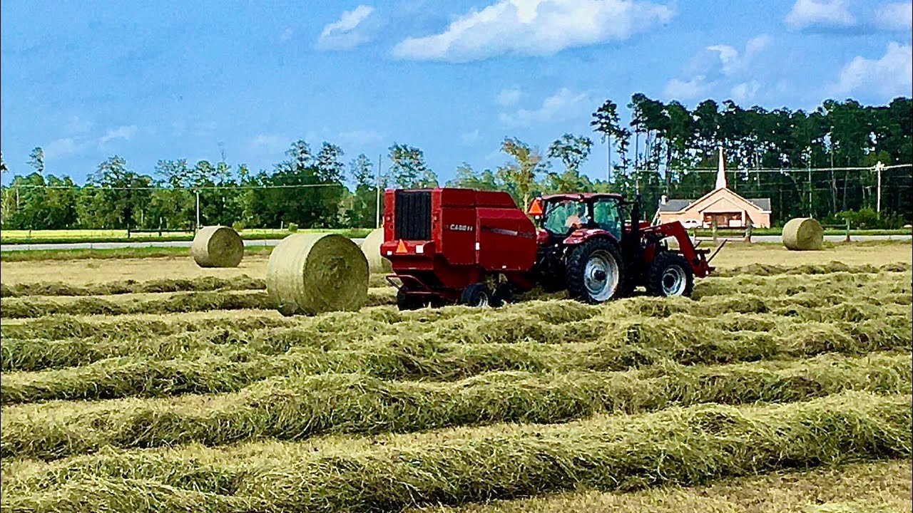 Raking with a Case 7250 Magnum RB 464 Round Baler