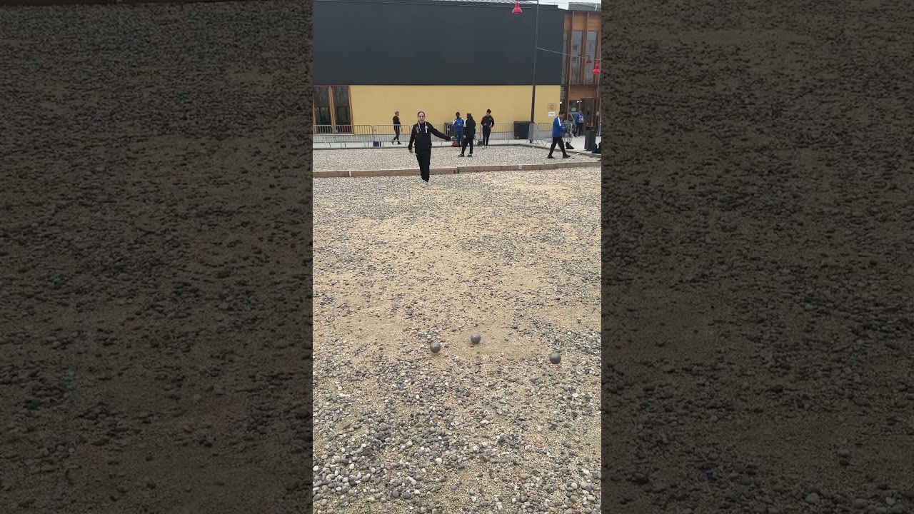 Kimberley shoots the top boule of the stack in P&egrave;tanque #boules #petanque