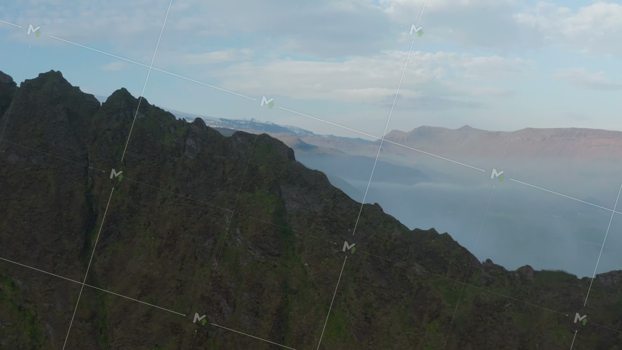 Aerial view of foggy panorama of misty overcast highlands in Iceland. Drone view of rocky mountains