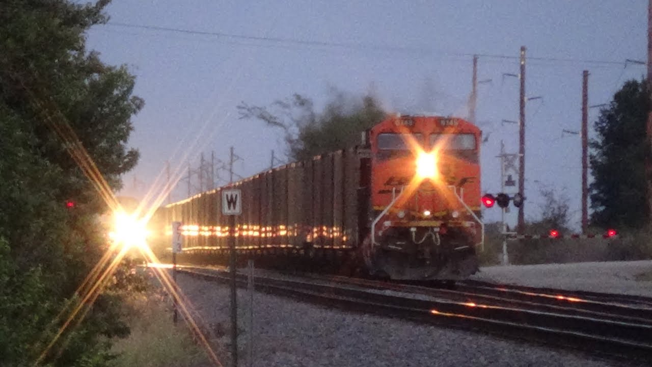BNSF Coal Train with Pink Car Meets Slow Amtrak
