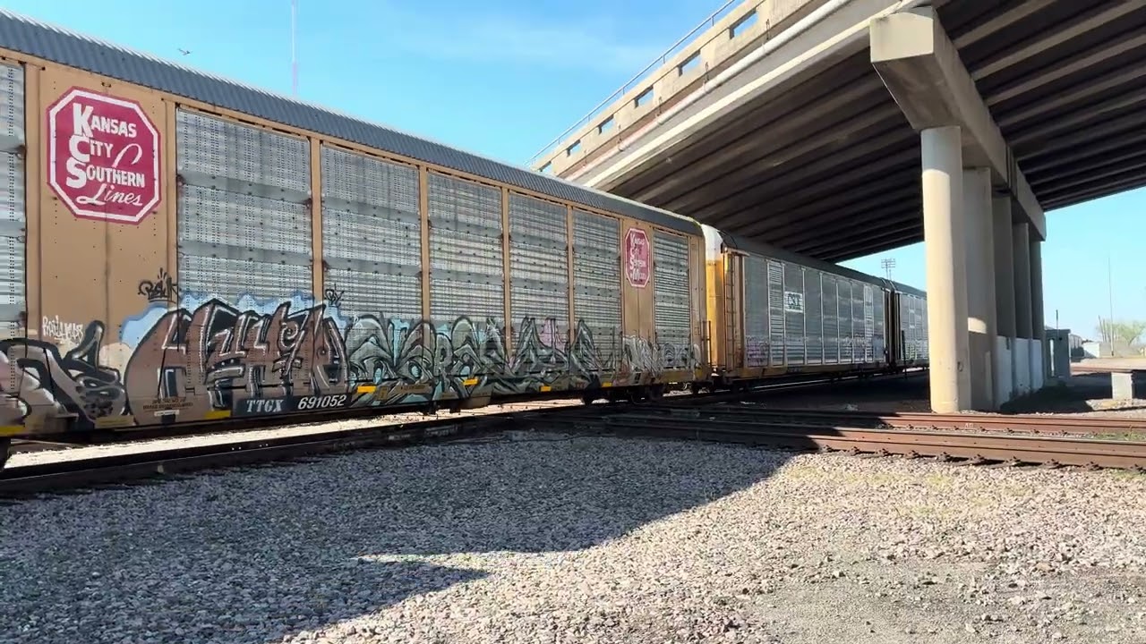 Long Kansas City Southern (KCS) Train Moves while KCS 4085 Trails in the Middle of the Train.