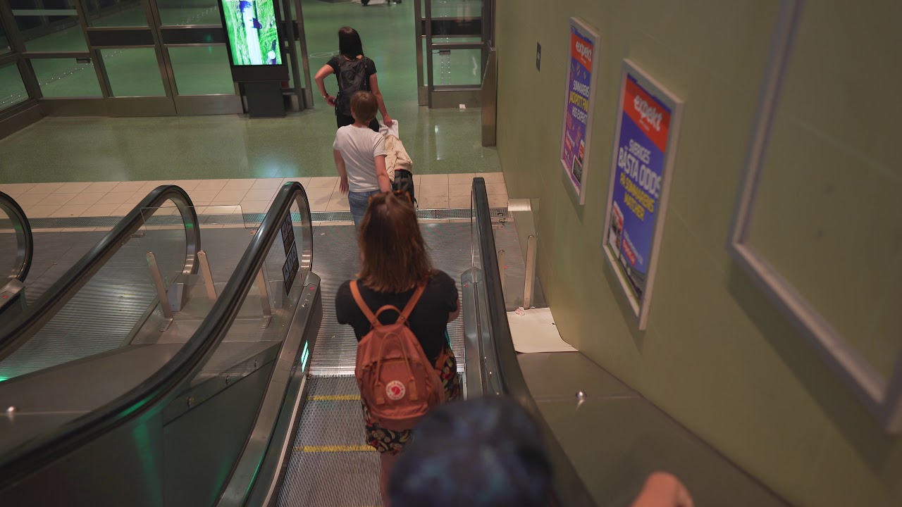 Sweden, Stockholm Odenplan train station, 2X escalator, 1X elevator - going down to platform level