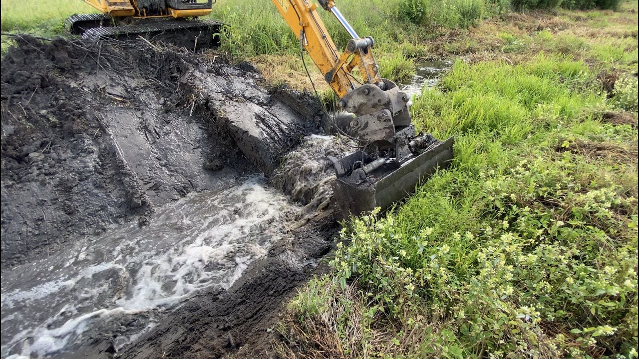 Breaking Beaver Dam with Excavator And Cleaning Canal.