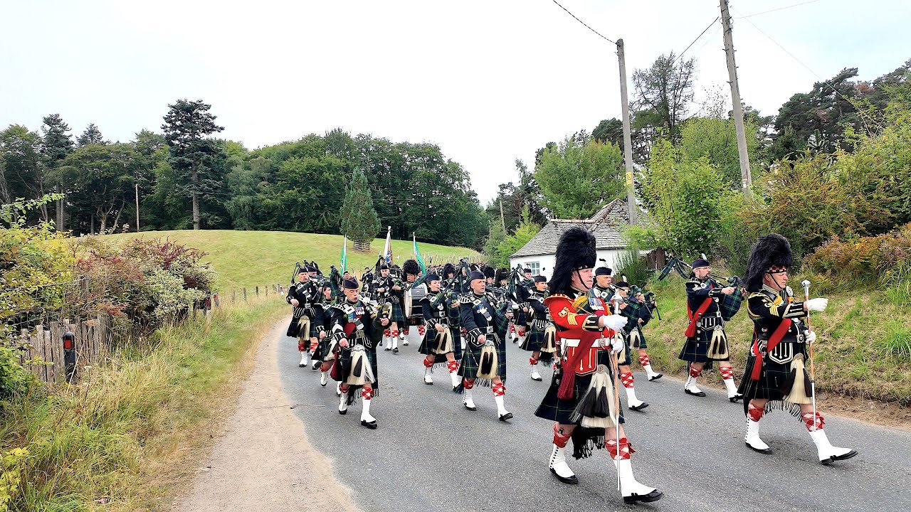 Lonach Highlanders march to drumbeat through Cairngorms during 2025 Lonach Gathering in Scotland