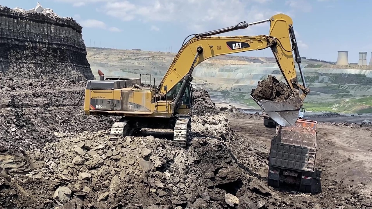 Caterpillar 365C Excavator Loading Mercedes And MAN Trucks - Operator Petros Kyrkos