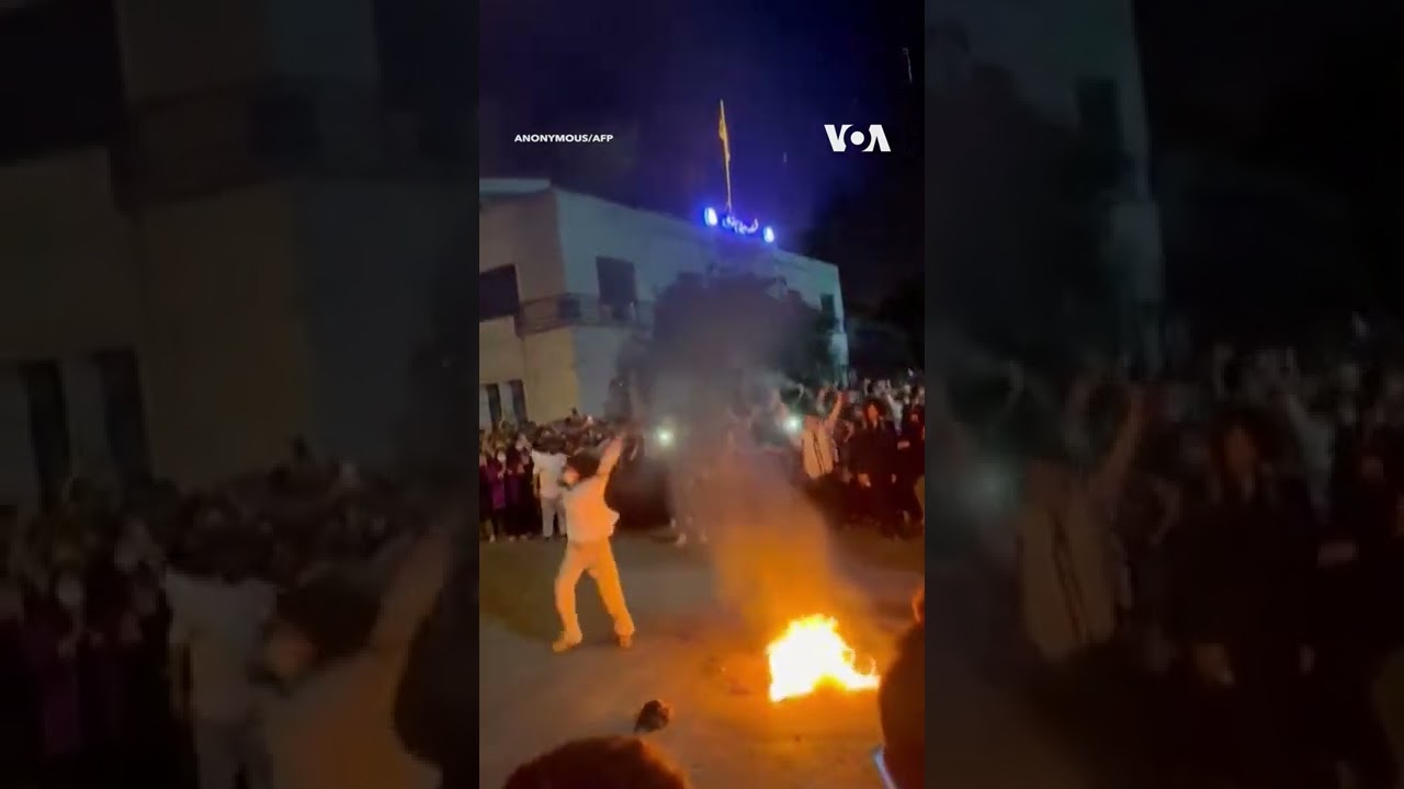 Woman Throws Hijab in Fire as Protests Spread in Iran #shorts