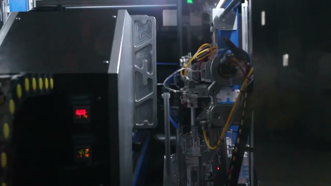 2 Cavity Bottom & Wraparound Label IML Robot by Axcela IML & Automation