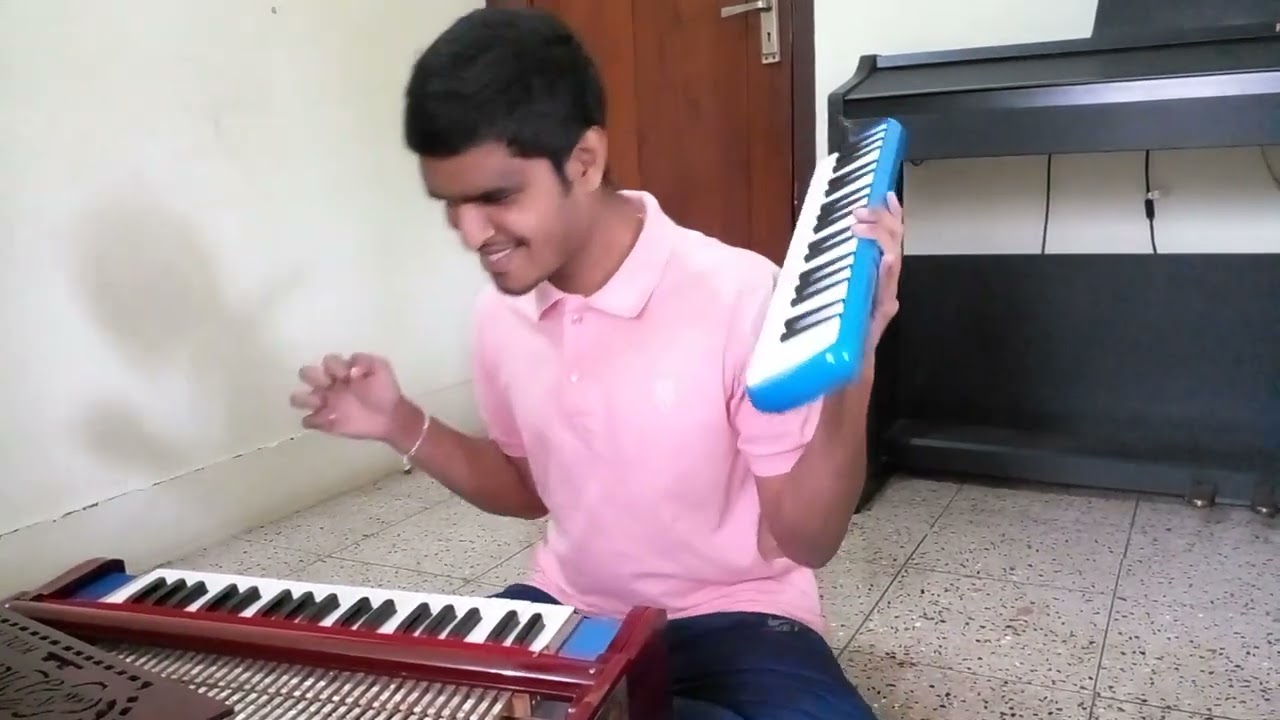surumayezhuthiya mizhikale malayalam song on both melodica and harmonium simultaneously