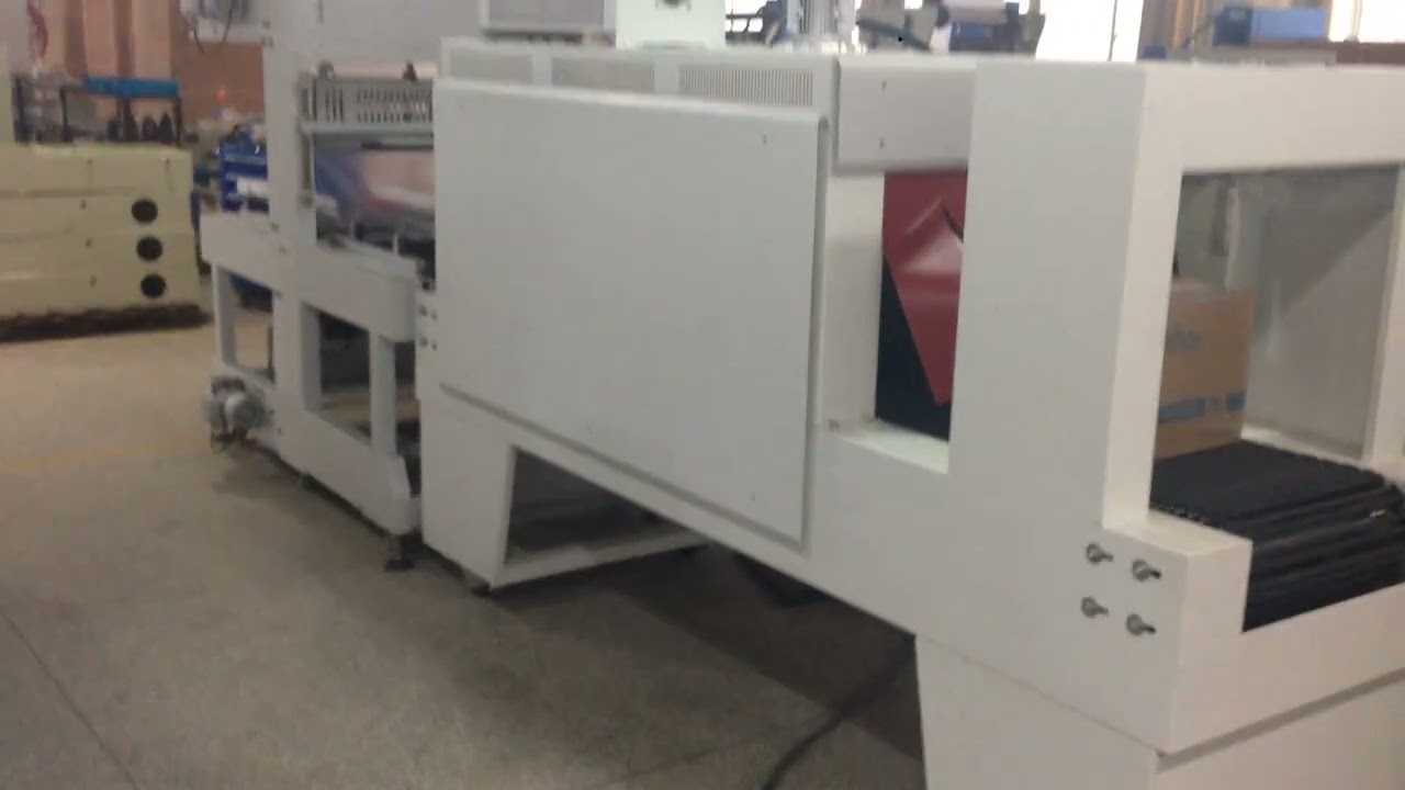 AUTOMATIC SLEEVE WRAPPER WITH SHRINK TUNNEL