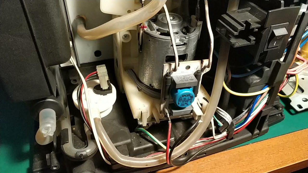 DeLonghi Magnifica - część 10 - prowadnica grupy i młynek