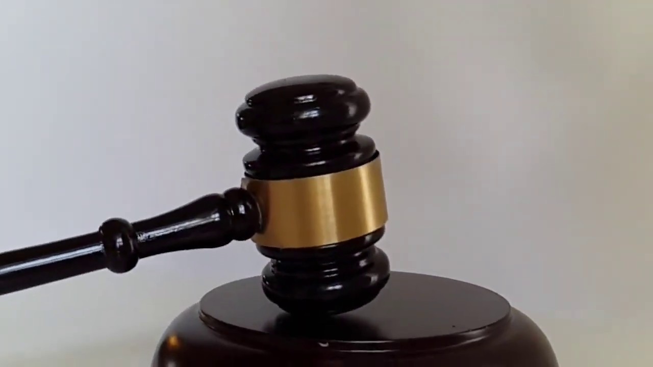 Judge gavel pounding in slow motion