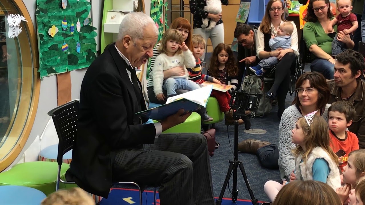 Derek Griffiths reads to children at Millennium Library in Norwich