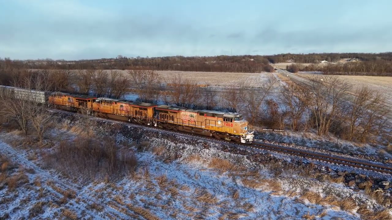 Drone video of southbound Union Pacific mixed freight in Cambridge, Iowa on the Spine Line
