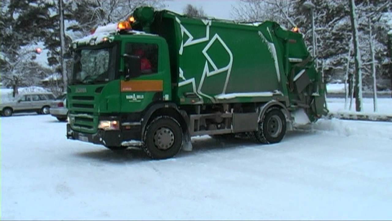 Garbage truck Scania collect garbage outside Visby 2012